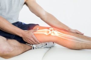 42576743 - digital composite of highlighted knee of injured man